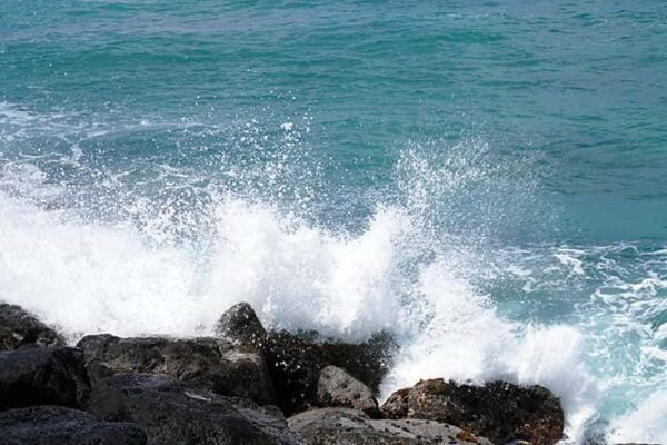 Ocean waves against rocks, Honolulu Hawaii